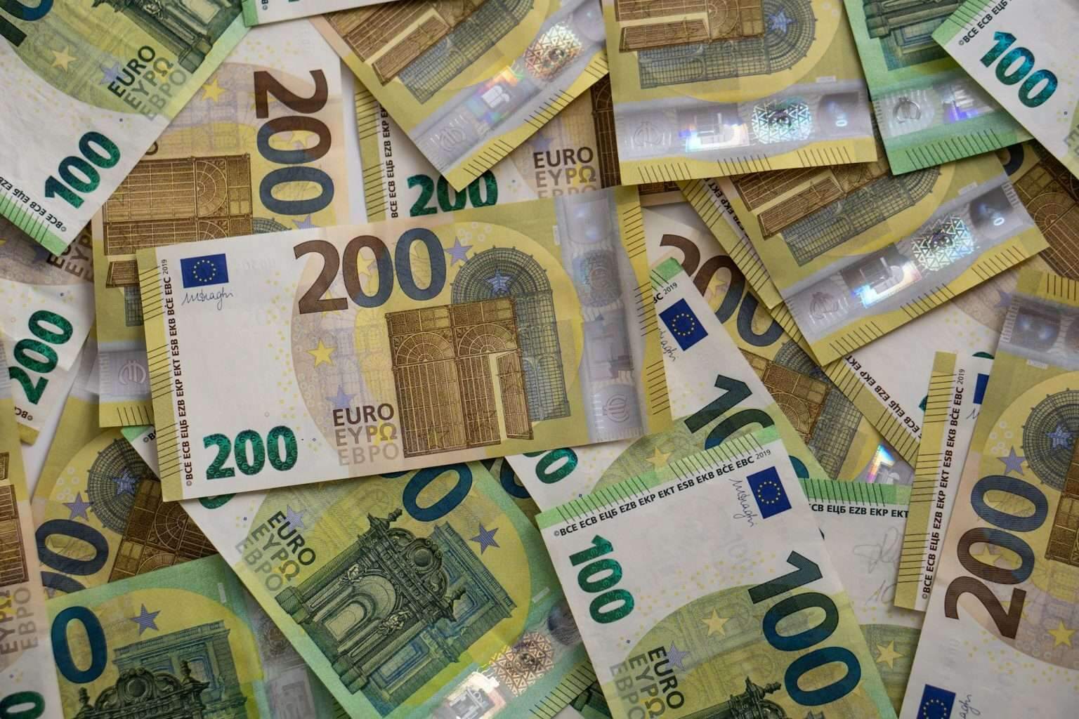 One hundred and two handred euros bills cash money