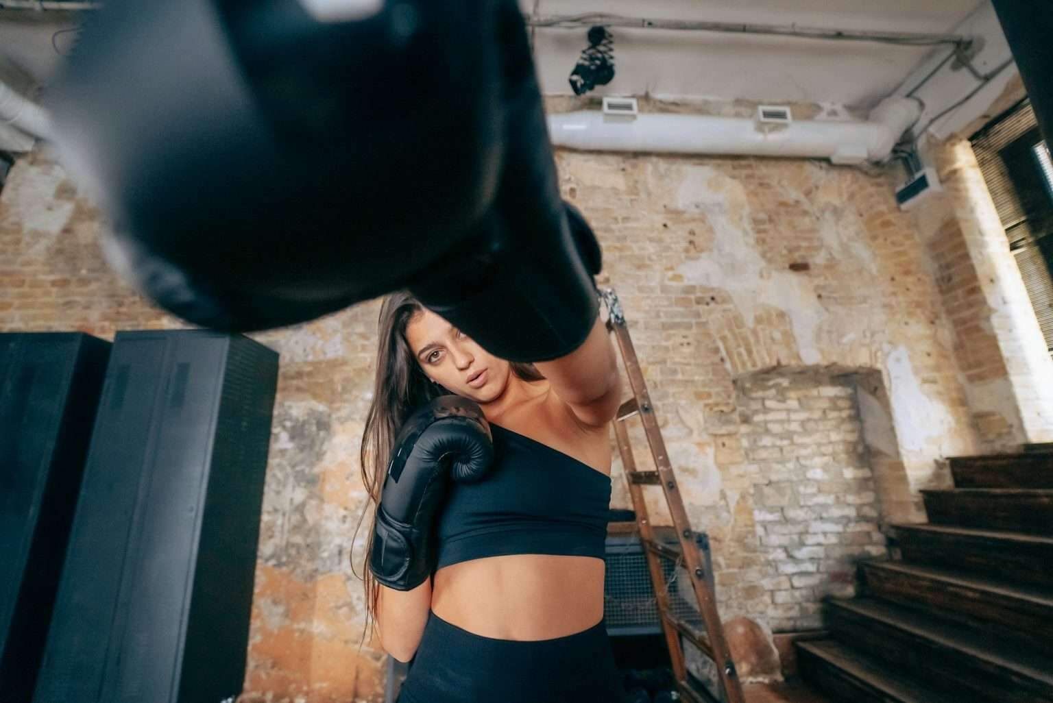 Young woman boxing workout at the gym