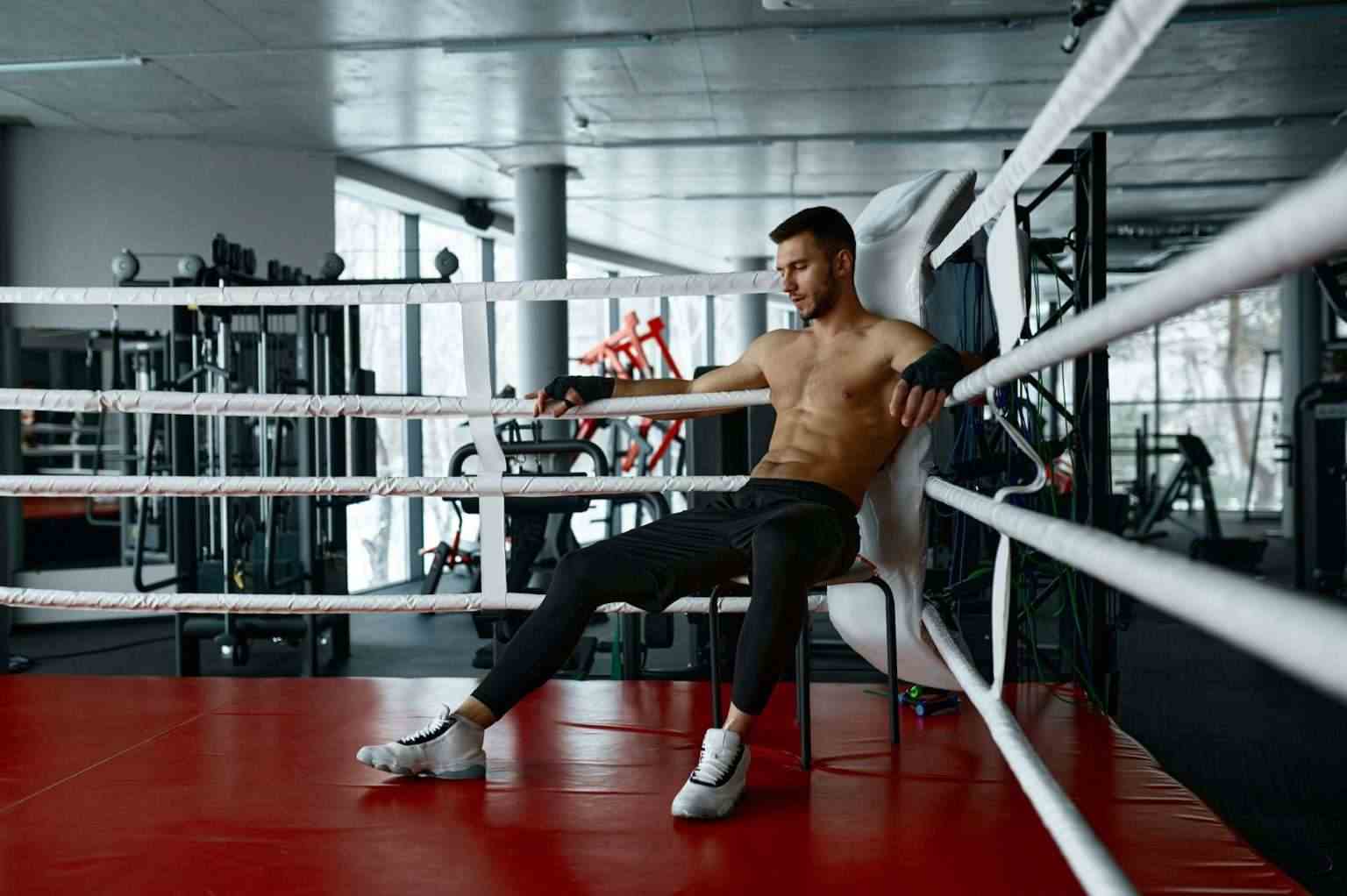 Boxer resting sit in boxer ring