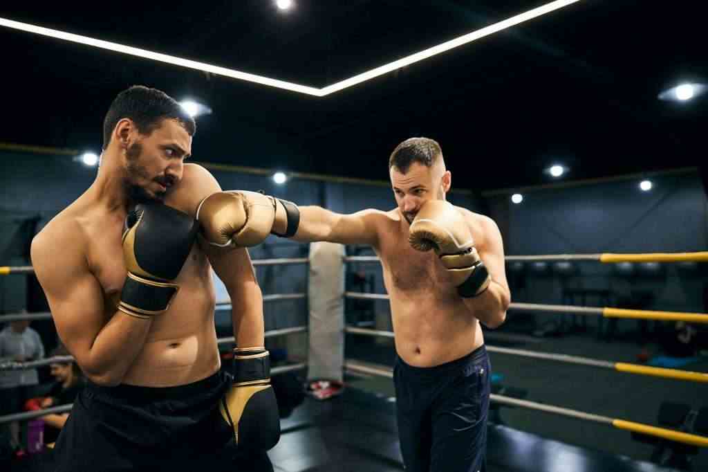 Fearful champion is evading his opponent blow