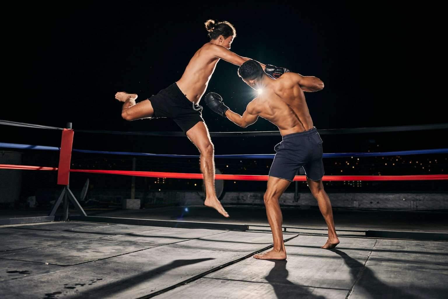 Mma, muay thai and fight with a boxing coach and training for health, fitness and sport exercise in