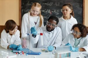 Teacher Demonstrating Chemical Reaction