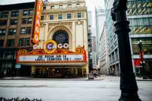 Vibrant view of the historic Chicago Theatre on a bustling downtown street.